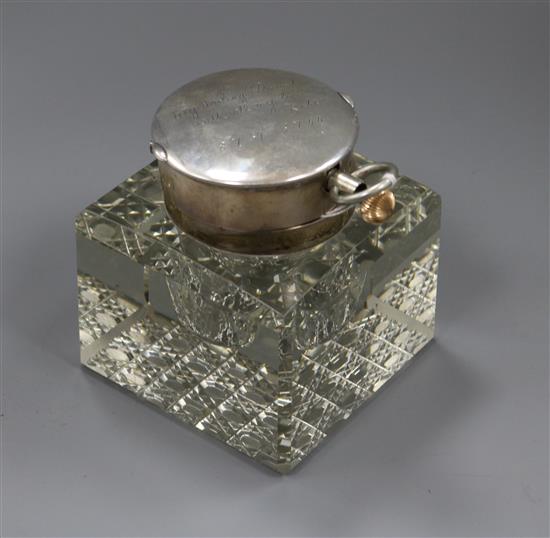 An Edwardian silver mounted cut glass combination inkwell/pocket watch holder, John Collard Vickery, London, 1903, height 11.1cm.